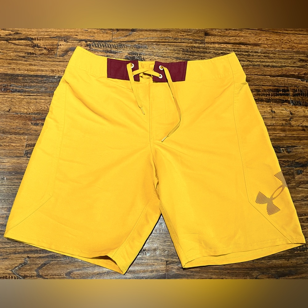 Under Armour yellow swim trunks size 34